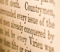 Macro detail of the pages of a book. Narrow focus on words on the right.